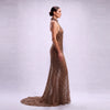 Side profile showing low back and fitted silhouette of mocha beaded mesh halter evening dress⁠