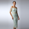 Model wearing 'The Gabriel' dress: a seafoam blue off-the-shoulder midi dress featuring intricate gold French hand-beaded tulle overlay and a luxury silk lining. Made in NYC.