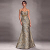 A strapless sweetheart mermaid gown in shimmering metallic gold and silver jacquard fabric, featuring a gold beaded waistband, modeled against a neutral gray studio background.
