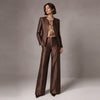 Front view of a model wearing Cenia New York's luxury chocolate brown silk-wool scalloped neckline jacket and matching tro