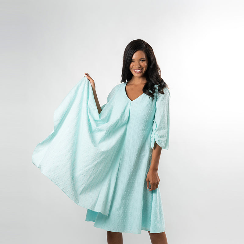 A draped overlay gives this fabulous piece a boho feeling while allowing you to show off your figure in a subtle way, extruding femininity. Made from a beautiful and airy cotton baby clip dot, this dress lends itfelf for many summer and spring affairs.