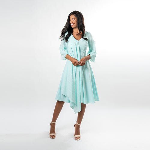 A draped overlay gives this fabulous piece a boho feeling while allowing you to show off your figure in a subtle way, extruding femininity. Made from a beautiful and airy cotton baby clip dot, this dress lends itfelf for many summer and spring affairs.