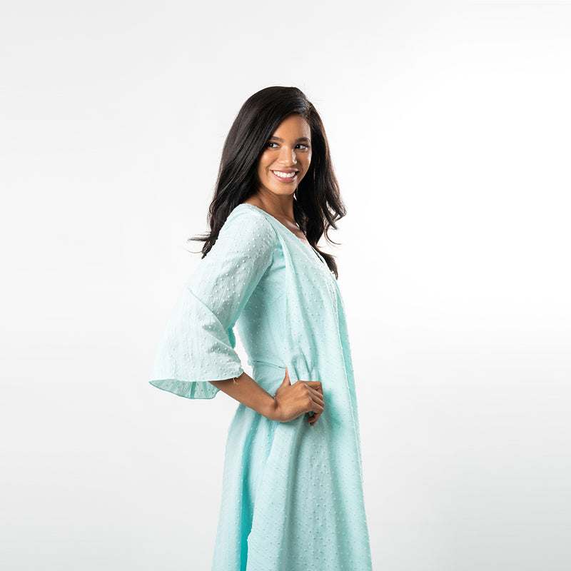A draped overlay gives this fabulous piece a boho feeling while allowing you to show off your figure in a subtle way, extruding femininity. Made from a beautiful and airy cotton baby clip dot, this dress lends itfelf for many summer and spring affairs.