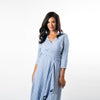 Not your ordinary shirt dress, this asymmetric hem wrap dress combines feminity with timeless classiness in a modern way.