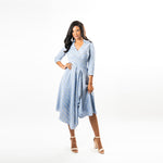 Not your ordinary shirt dress, this asymmetric hem wrap dress combines feminity with timeless classiness in a modern way.